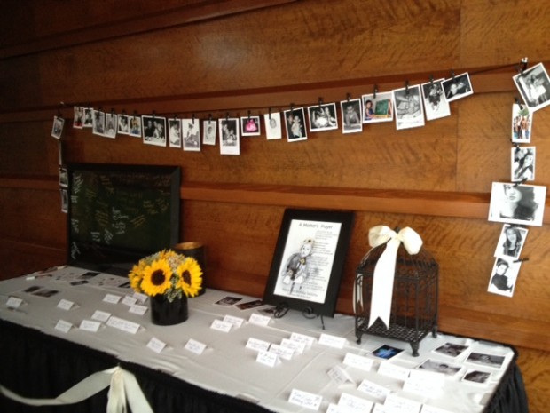 Vintage Wedding guest table...beautiful set-up! Love the childhood polaroids hanging off the clothesline! 